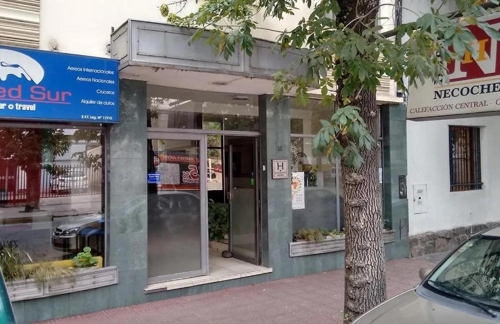 a store front of a building with a sign on it at Hotel Necochea in Mendoza