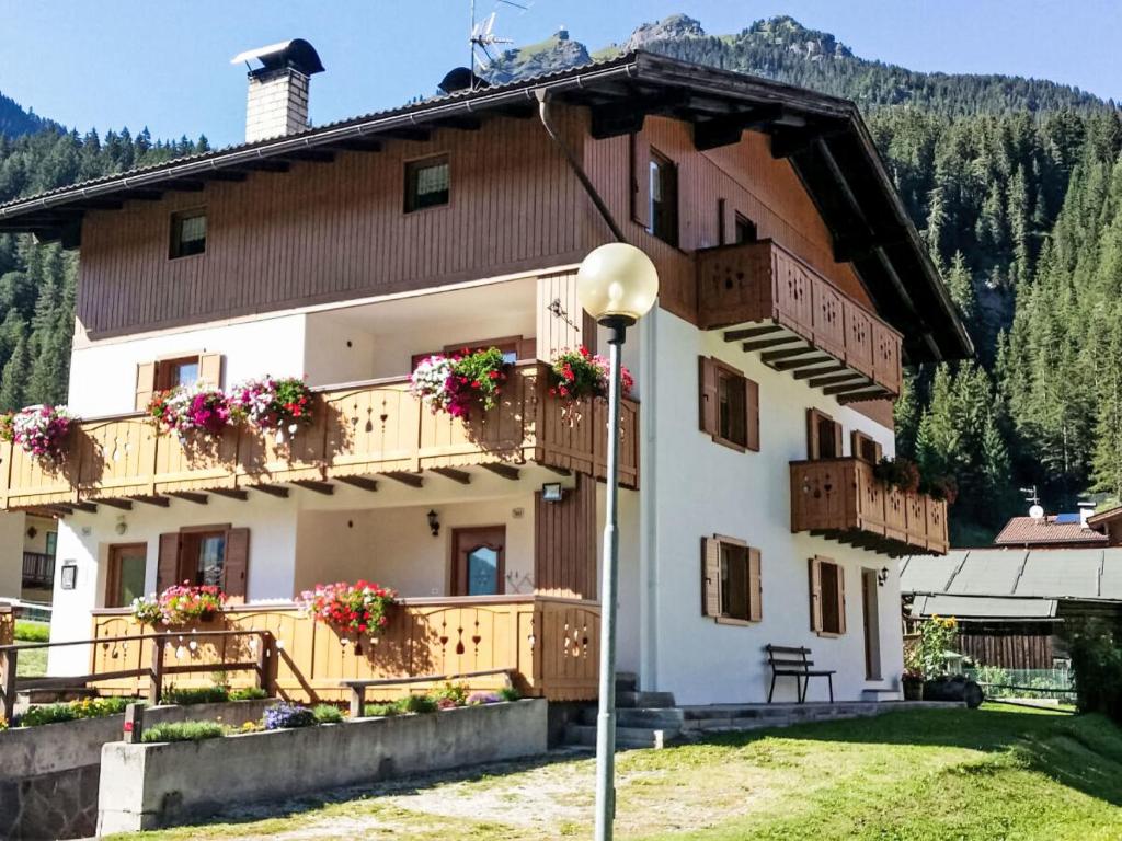 a large building with balconies and flowers on it at Apartment Cristina by Interhome in Campestrin