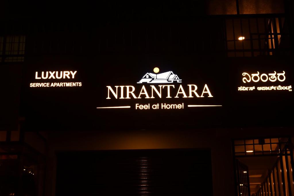 a sign that says nieminario on a building at Nirantara Luxury Service Apartment in Gonikoppal