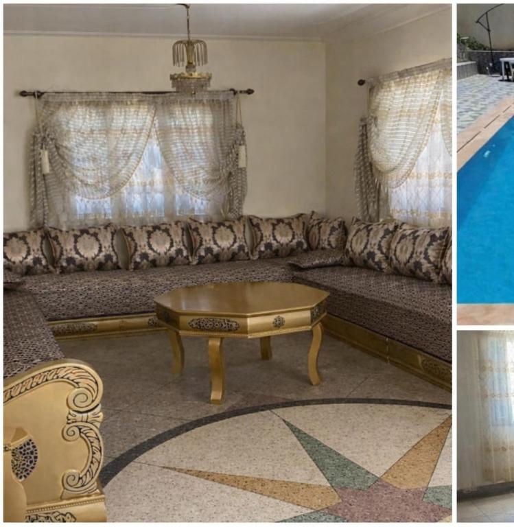 a living room with a couch and a coffee table at Villa appartement jardin et piscine in Meknès