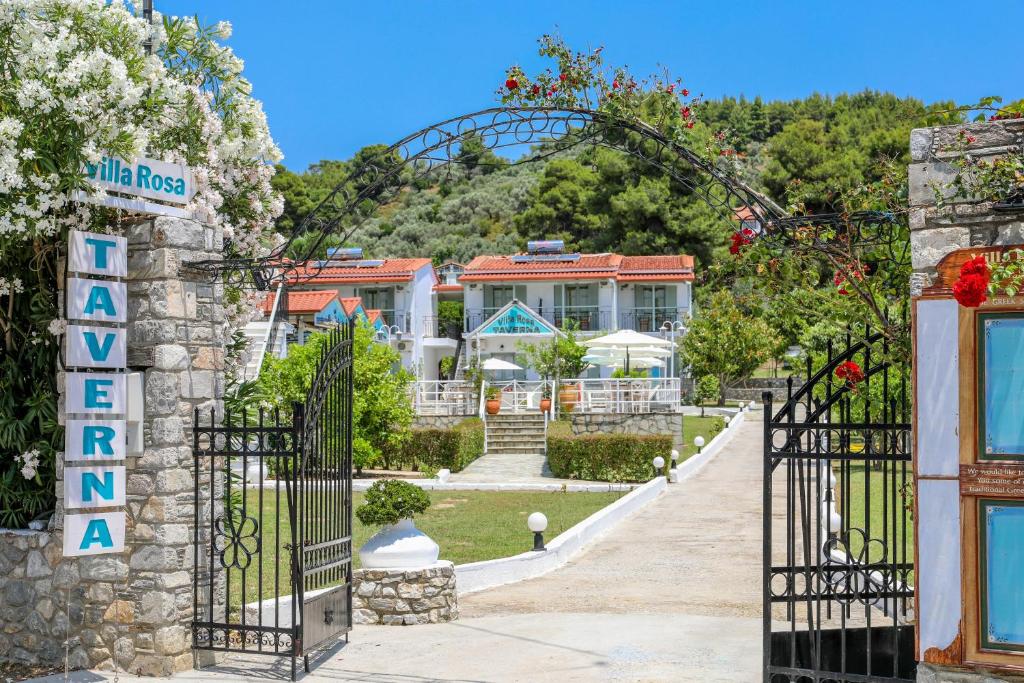an entrance to a resort with an iron gate at VILLA ROSA in Troulos