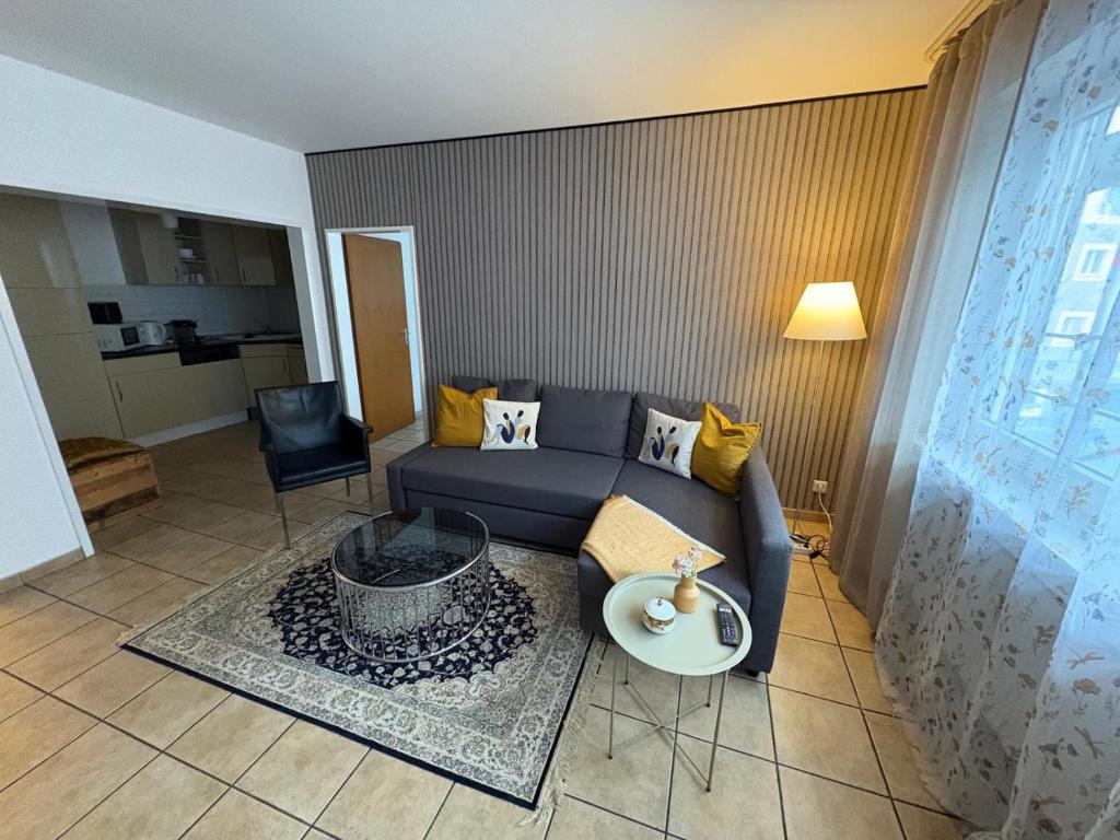 a living room with a couch and a table at Cozy Aparment 4 at Cathedral in Cologne