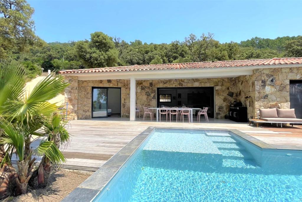 a villa with a swimming pool and a patio at Villa Concarella Di Conca in Conca