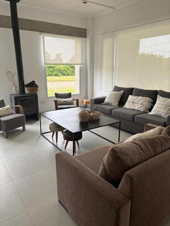 a living room with a couch and a coffee table at Nuestro Lugar Soñado in Concepción del Uruguay