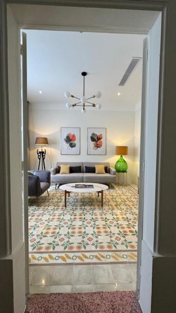 a living room with a couch and a table at Casa Maria in Żabbar
