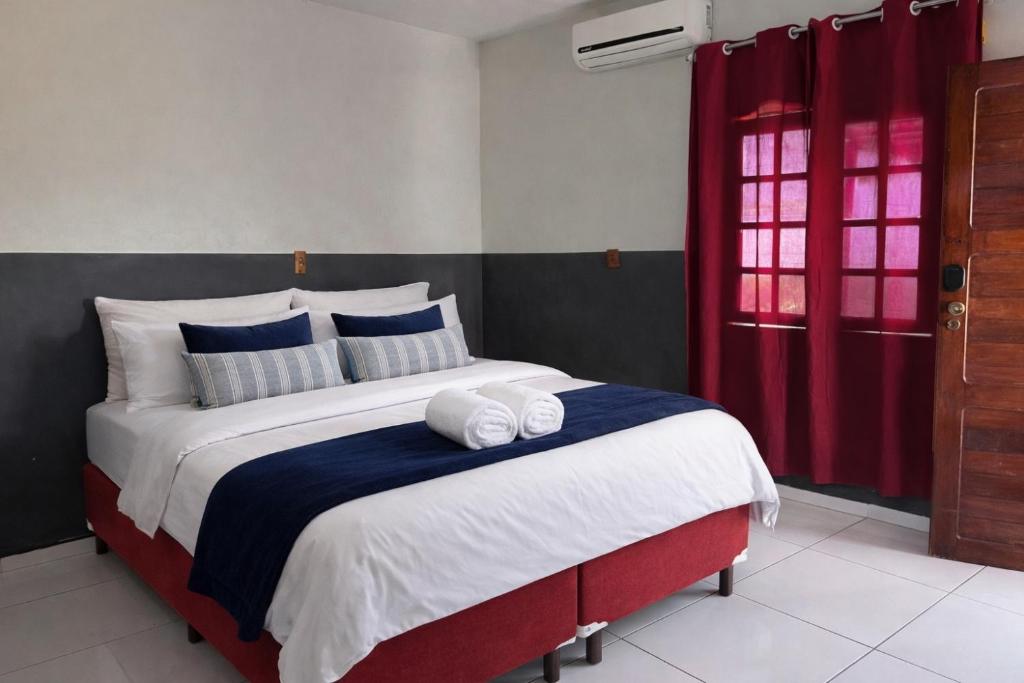 a bedroom with a large bed with two towels on it at Rancho tareco e mariola in Petrolina