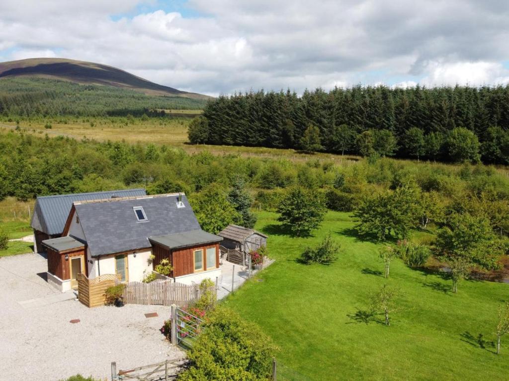an aerial view of a house in a field at 2 Bed in Ardross oc-ca384 in Stittenham