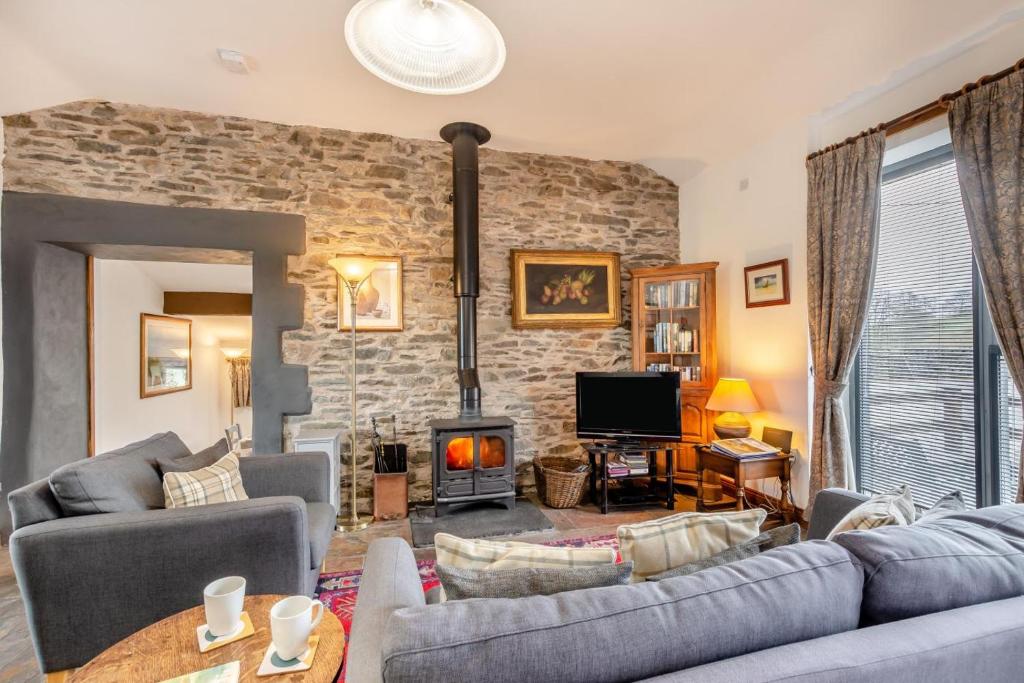 a living room with a couch and a fireplace at 1 Bed in Windermere oc-f31665 in Crook