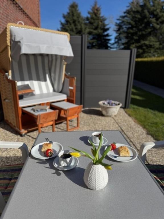 a table with two plates of food on it at Backhuus 1 in Fehmarn