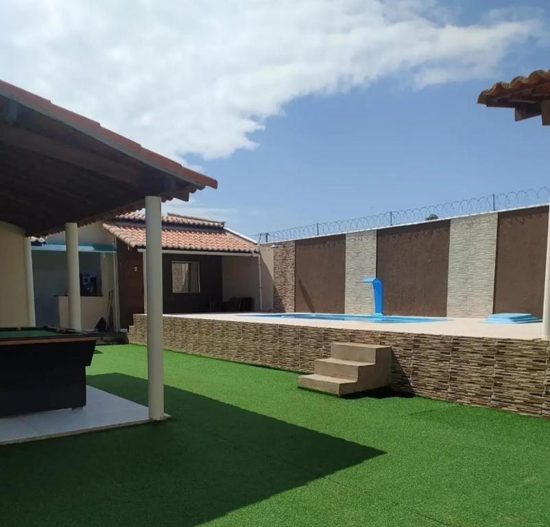 a rendering of a house with a green lawn at Tô A Tôa in Touros