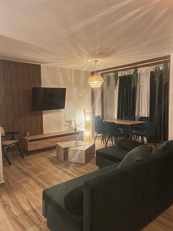a living room with a couch and a table at Bega's BDuplex in Golem, Durrës in Golem