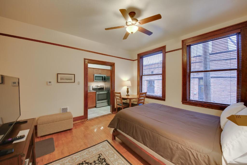 a bedroom with a bed and a ceiling fan at Epic Silver Valley Basecamp: Steps to Dtwn Fun! in Wallace