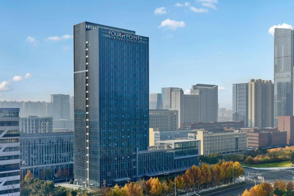 a tall glass building in a large city at Four Points by Sheraton Hefei High-Tech Zone in Hefei