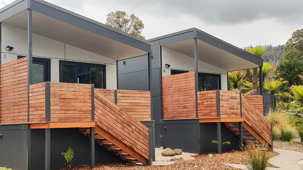 a house with wooden decks on the side of it at Mt Field Retreat in National Park