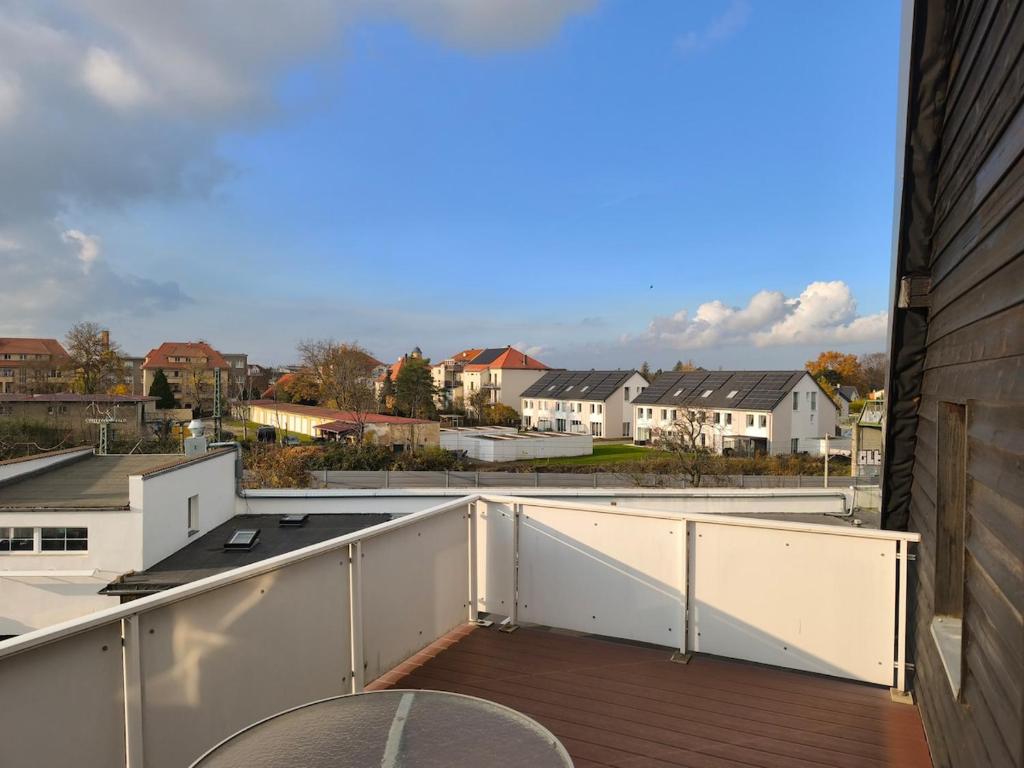 a balcony with a view of a city at Maisonette with large terrace in Leipzig