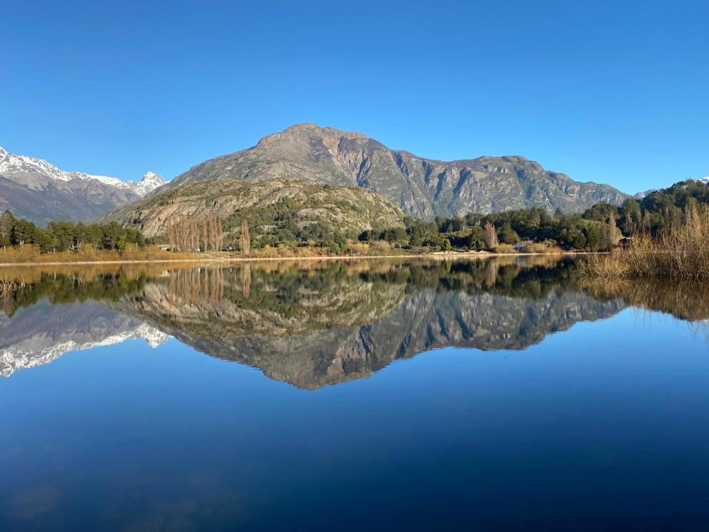a view of a lake with mountains in the background at Cabañas Antonia in Futaleufú