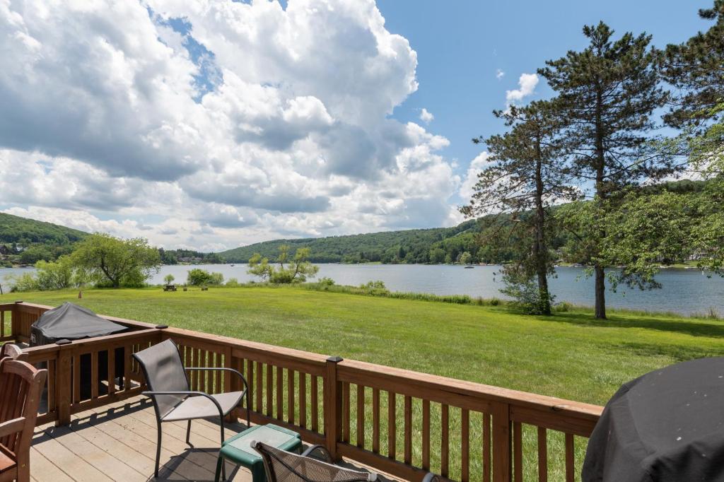 a deck with chairs and a view of a lake at Ski Harbor #21 by Railey Vacations in McHenry