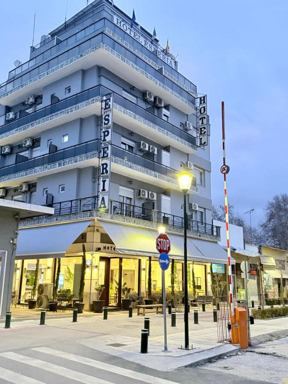 a building with a stop sign in front of it at ESPERIA Drama HOTEL in Drama