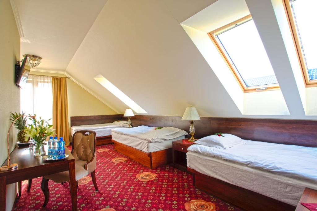 Posteľ alebo postele v izbe v ubytovaní Hotel Róża