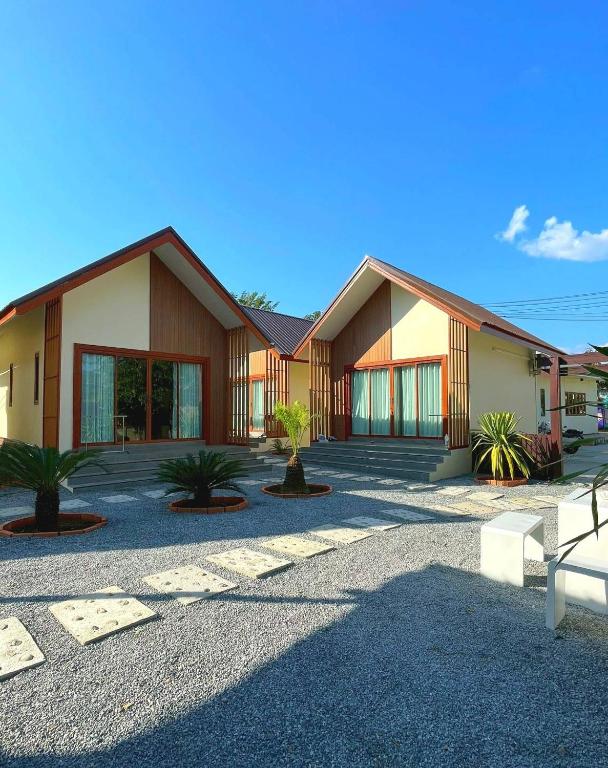 a house with a lot of plants in front of it at Chortip House in Pai