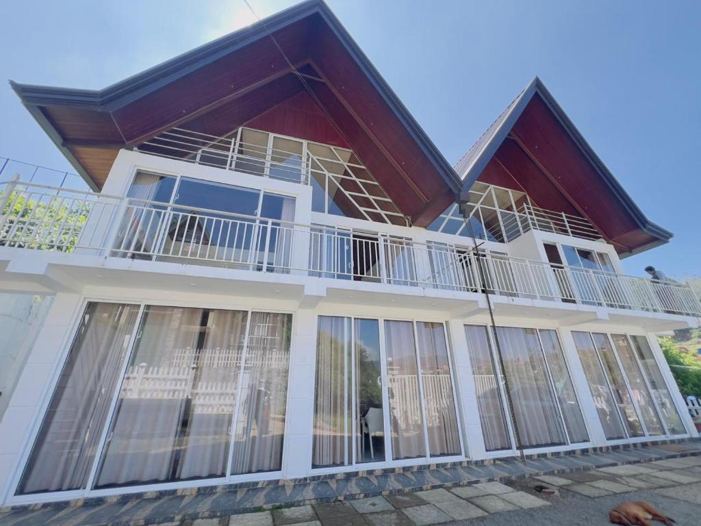 a house with large windows and a balcony at Blackpool Hub in Nikawatawana