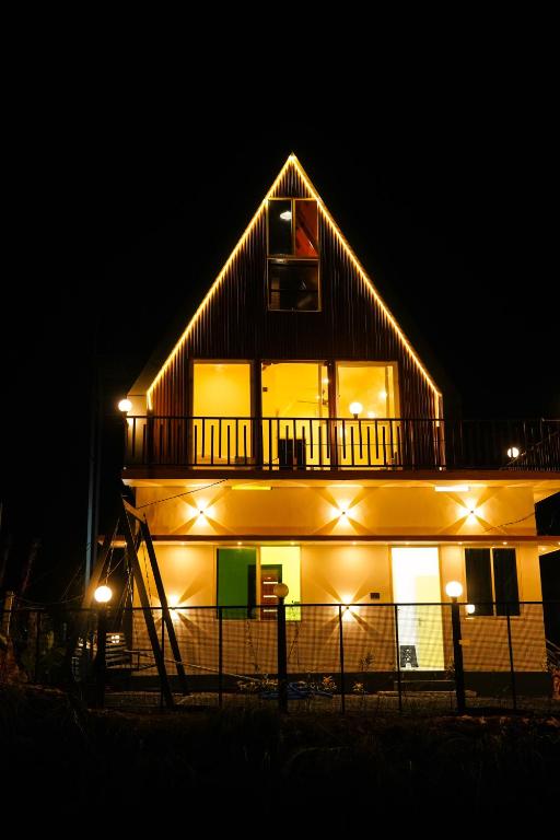 a building with lights on it at night at DreamNest Vagamon in Vagamon