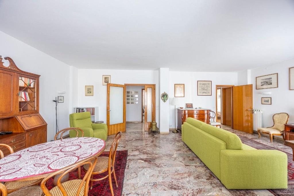 a living room with a table and a couch at Italian Experience-Mestrina Apartment in Mestre