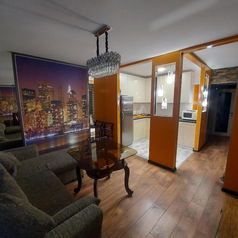 a living room with a couch and a table at Абзал in Karagandy