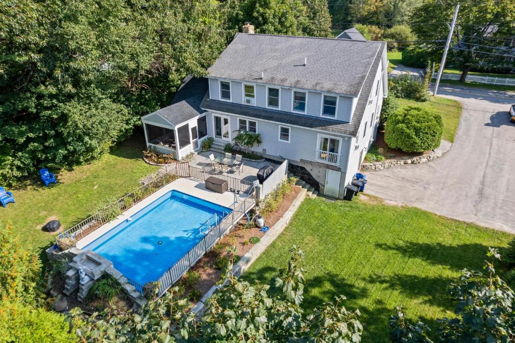 an aerial view of a house with a swimming pool at Tidepools Retreat Poolside Family Fun in York
