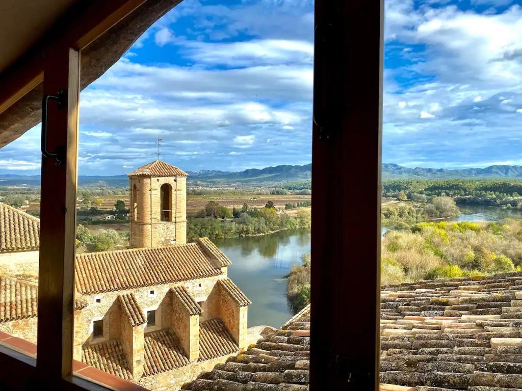 a view from a window of a building and a river at Ebrevista in Miravet