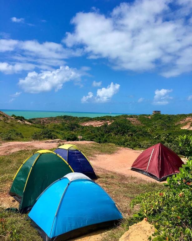 a group of tents sitting in the grass at EcoCamping da Wandinha in Cabo de Santo Agostinho