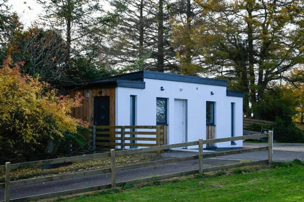 a tiny house on the side of a road at Viewpoint Pods in Dunollie