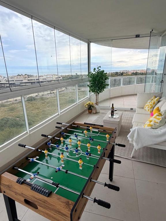a room with a ping pong table in the middle at Luxury Canet in Canet de Berenguer