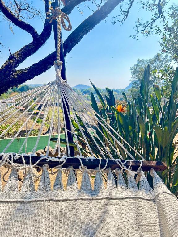 a hammock with a view of a garden at Incredible 360 views 5 min from downtown in Tepoztlán