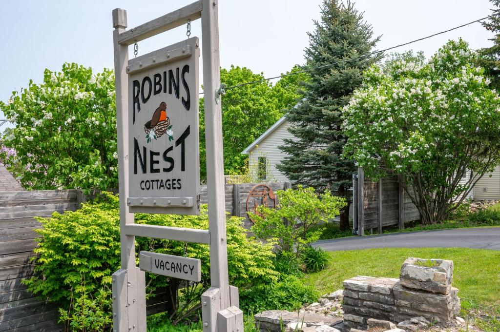a sign for arosing next to a house at Fish Creek Cottages in Fish Creek
