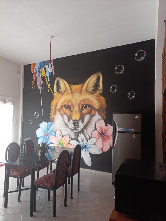 a painting of a fox on a wall at Kallpa in Tinogasta