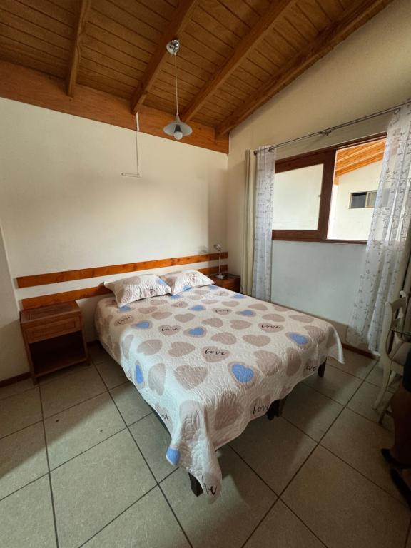 a bedroom with a bed in a room at Hostal Asuncion in Arica