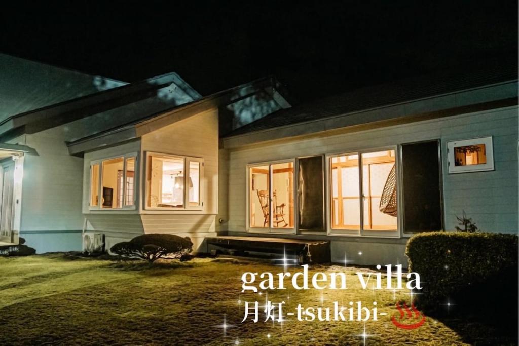 a home at night with the lights on at garden villa 月灯tsukibi in Shiraoi