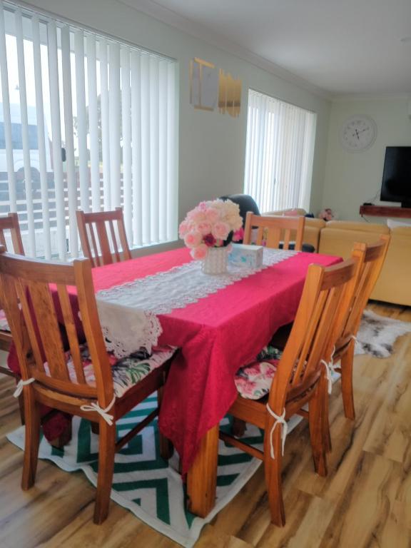a dining room table with a red table cloth at Lakeside view in Cuthbert
