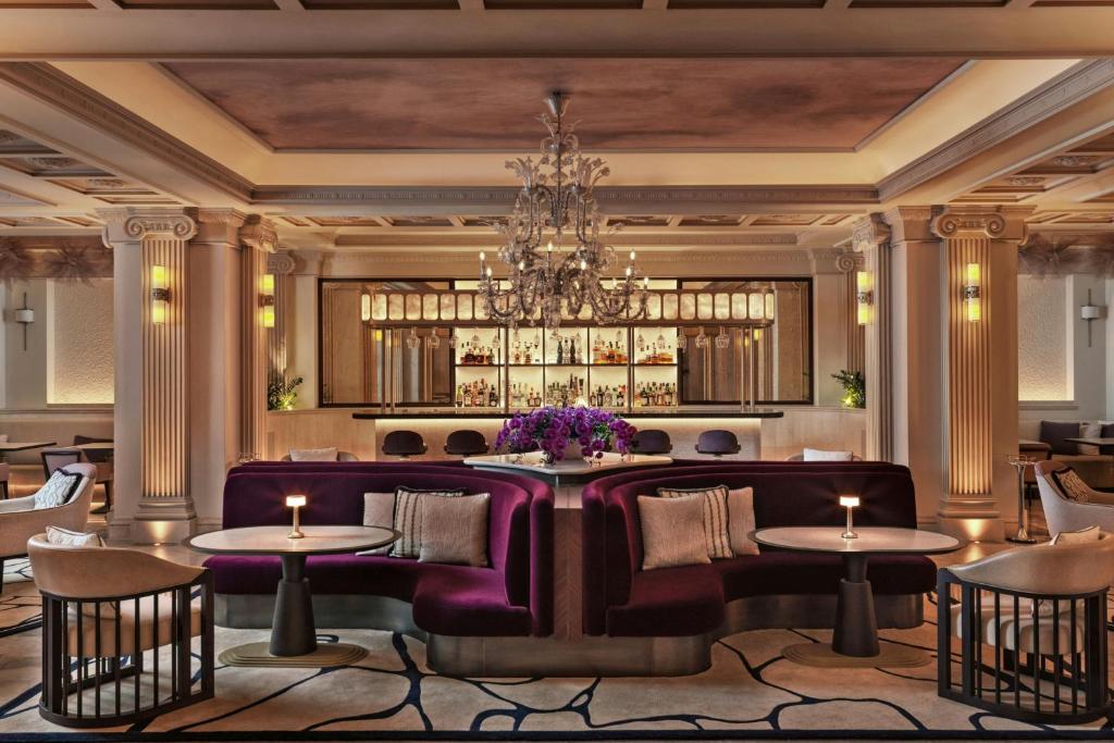 a rendering of a restaurant with purple booths and tables at King George, a Luxury Collection Hotel, Athens in Athens