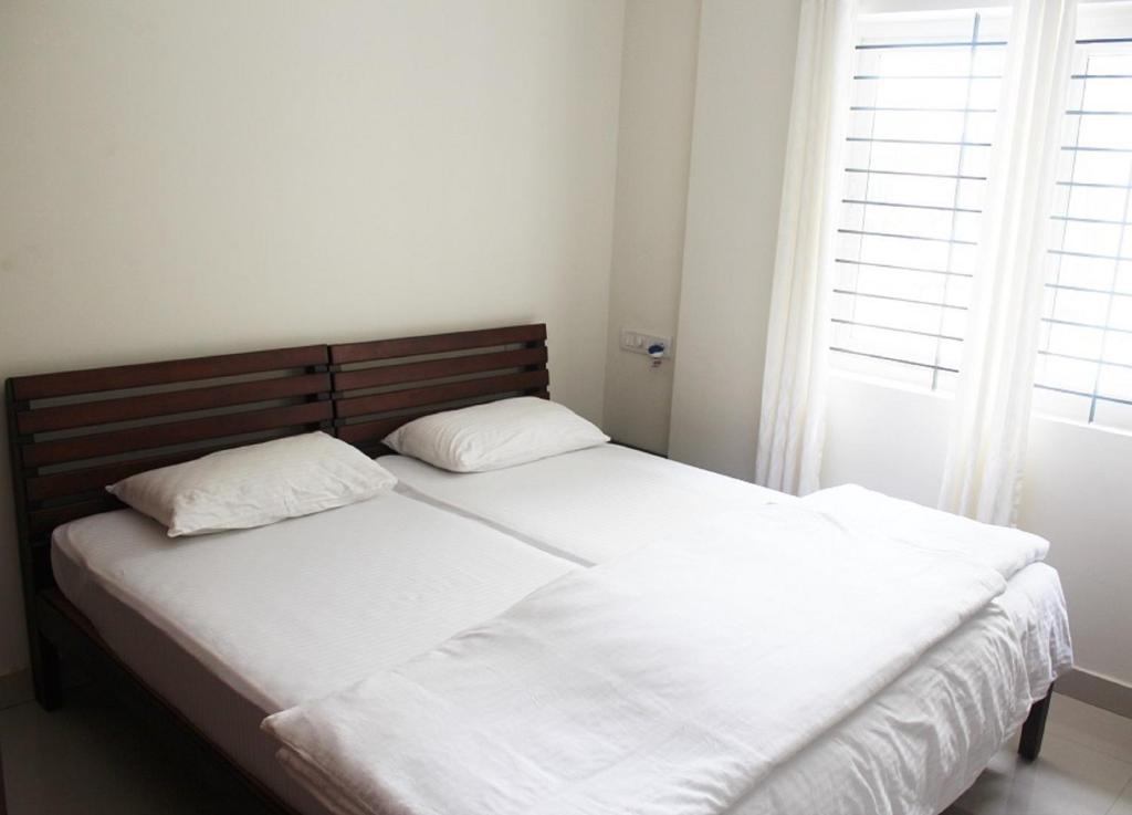 Postel nebo postele na pokoji v ubytování Stayzone 365 Inn