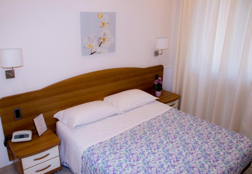 Postel nebo postele na pokoji v ubytování Hotel Ristorante Sbranetta
