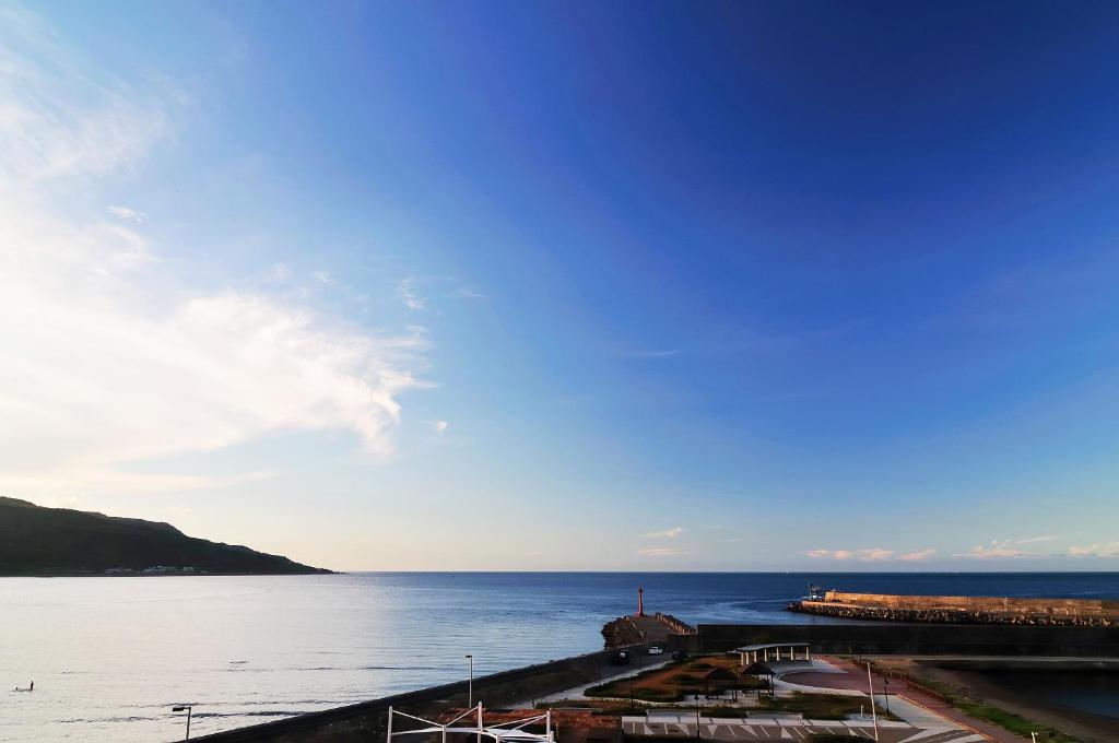 a view of a body of water with at JinShan Sakura Bay Hot Spring Hotel in Jinshan