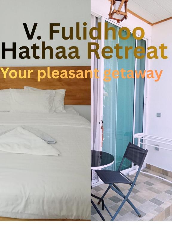 a bedroom with a bed and a chair and a table at Fulidhoo Hathaa Retreat in Fulidhoo