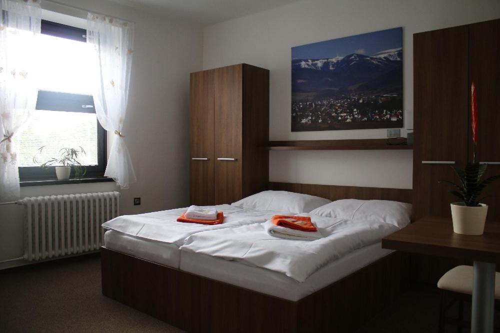 Postel nebo postele na pokoji v ubytování Hotel Pod Radnicí