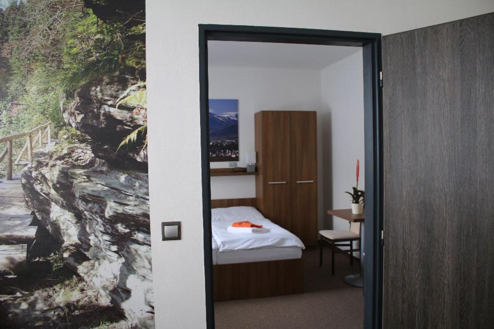 Postel nebo postele na pokoji v ubytování Hotel Pod Radnicí