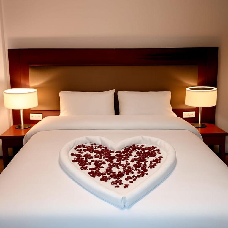 a bed with a heart made out of roses at Leopard edirne in Edirne