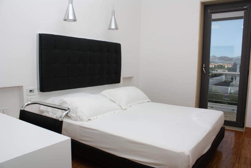 Postel nebo postele na pokoji v ubytování Hotel Del Conte
