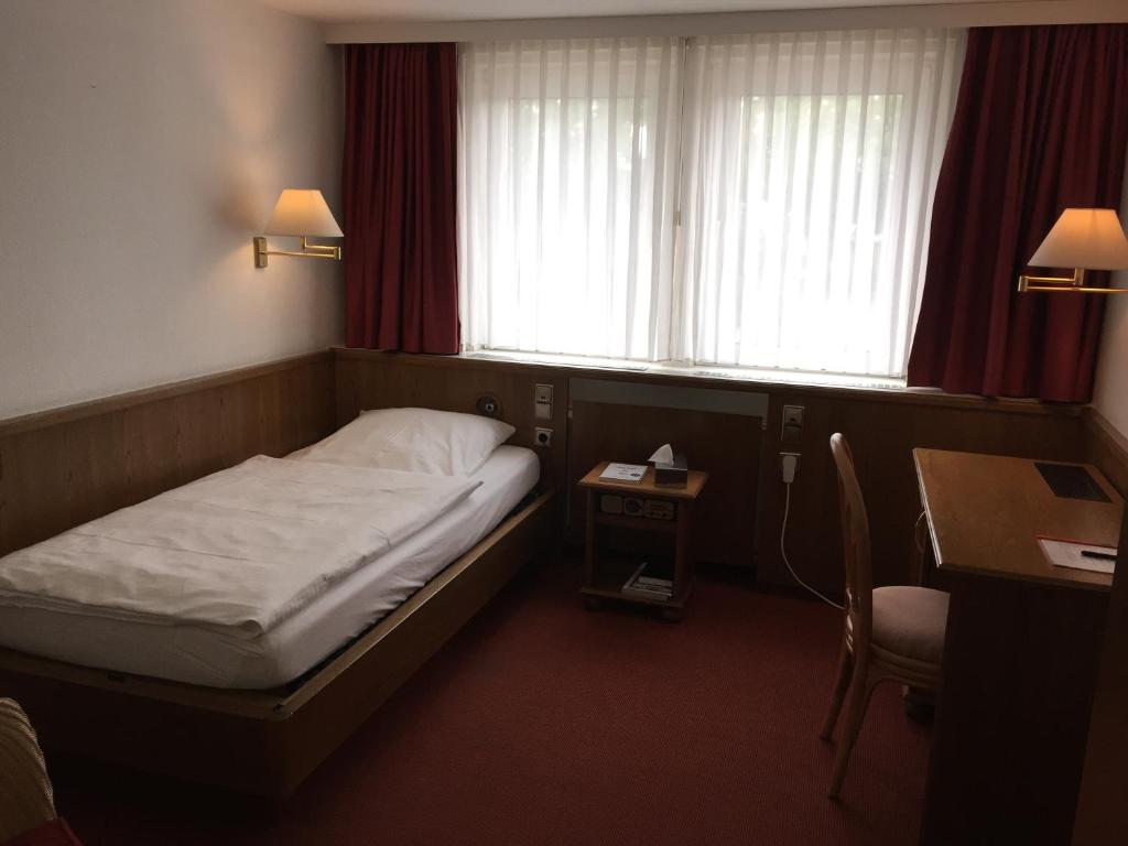 Postel nebo postele na pokoji v ubytování Schaperkrug