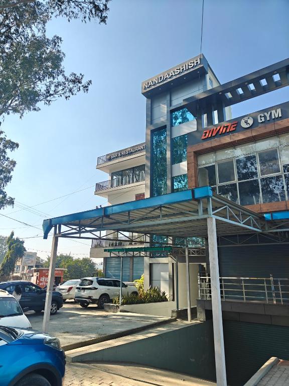 a sunoco gas station in front of a parking lot at Hotel Nandaashish in Haldwāni
